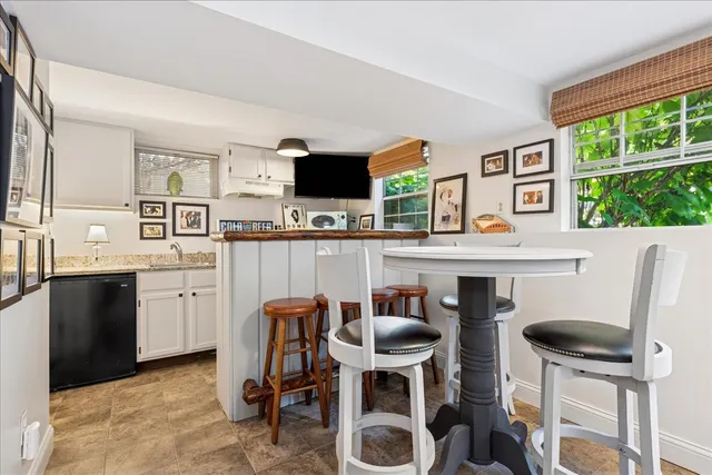 a living room with furniture fireplace and flat screen tv