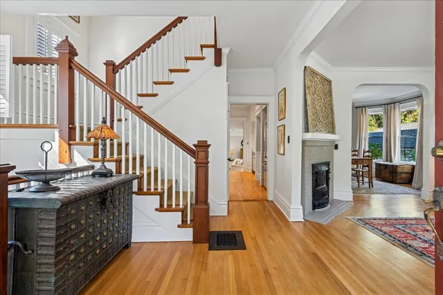a view of entryway livingroom and hall with wooden floor