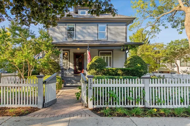 a picture of a room with a white wall and painting