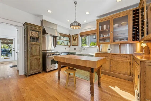 a kitchen with stainless steel appliances granite countertop a stove and refrigerator