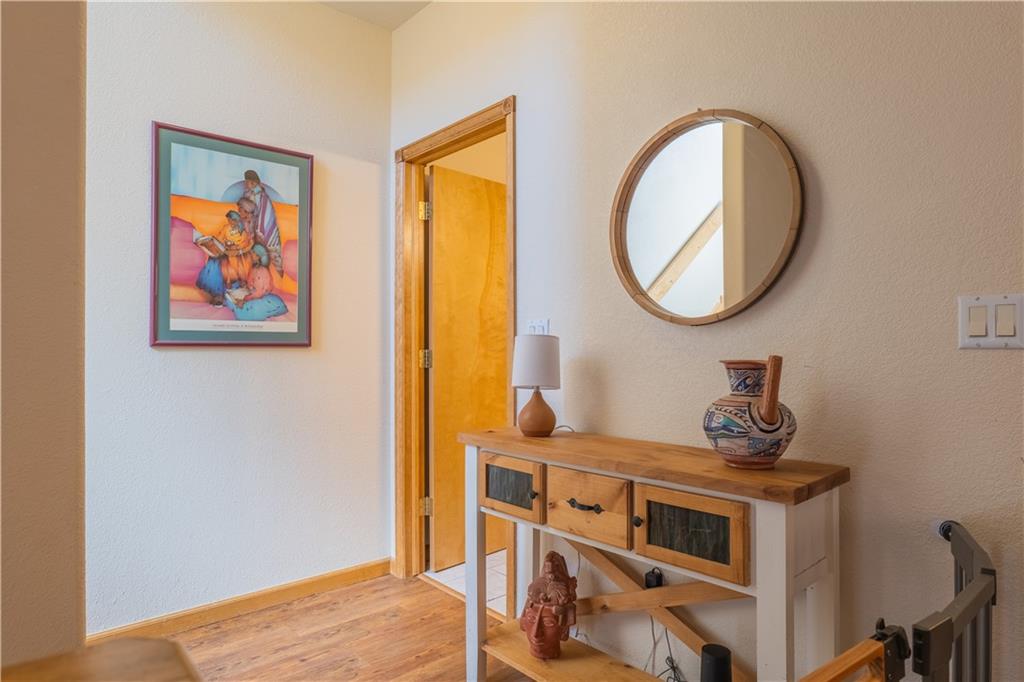 7 Lookout Ridge Drive, Unit 7 Dillon, CO 80435 - Photo 12 of 35 a view of a bedroom with a bed and wooden floor