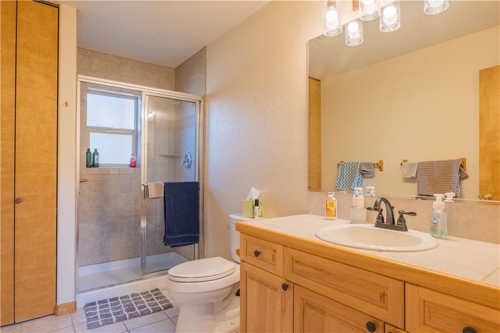 7 Lookout Ridge Drive, Unit 7 Dillon, CO 80435 - Photo 13 of 35 a bathroom with a sink a toilet and shower