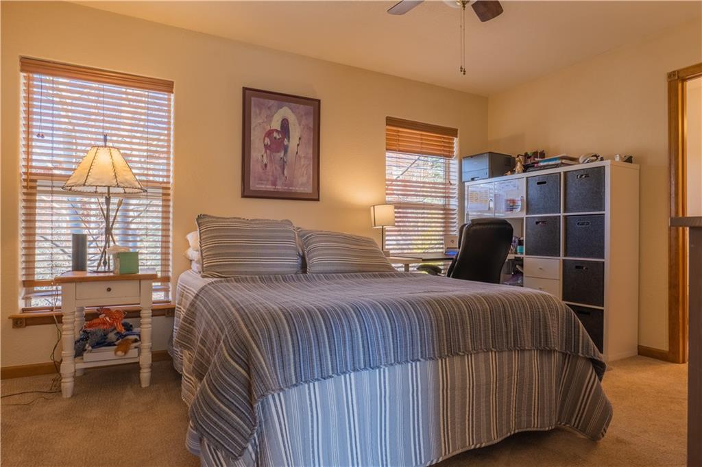 7 Lookout Ridge Drive, Unit 7 Dillon, CO 80435 - Photo 16 of 35 a bedroom with a bed and wooden floor