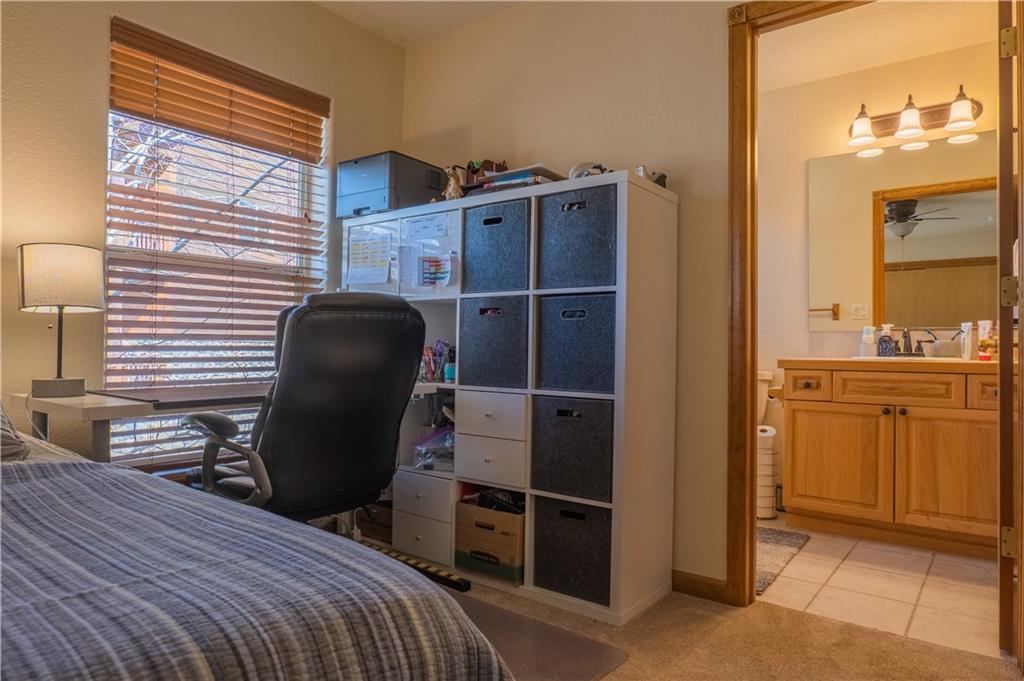 7 Lookout Ridge Drive, Unit 7 Dillon, CO 80435 - Photo 18 of 35 a bedroom with a bed and cabinets