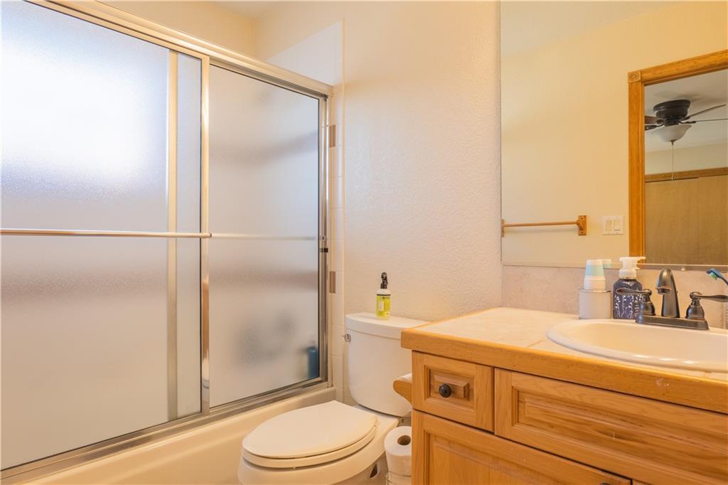 7 Lookout Ridge Drive, Unit 7 Dillon, CO 80435 - Photo 19 of 35 a bathroom with a granite countertop sink toilet and shower