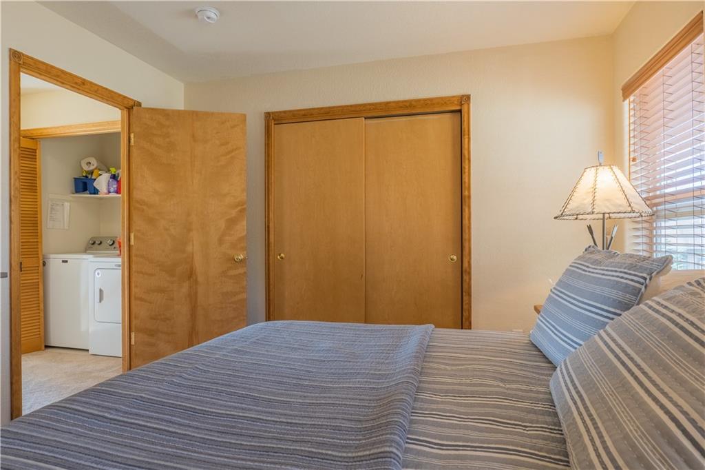 7 Lookout Ridge Drive, Unit 7 Dillon, CO 80435 - Photo 20 of 35 a bedroom with a bed and a table