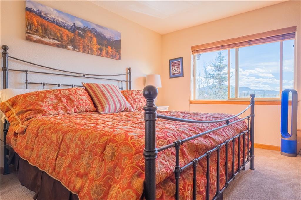 7 Lookout Ridge Drive, Unit 7 Dillon, CO 80435 - Photo 22 of 35 a blue bed sitting in front of a window