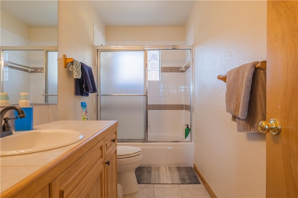 7 Lookout Ridge Drive, Unit 7 Dillon, CO 80435 - Photo 25 of 35 a bathroom with a sink a toilet and shower