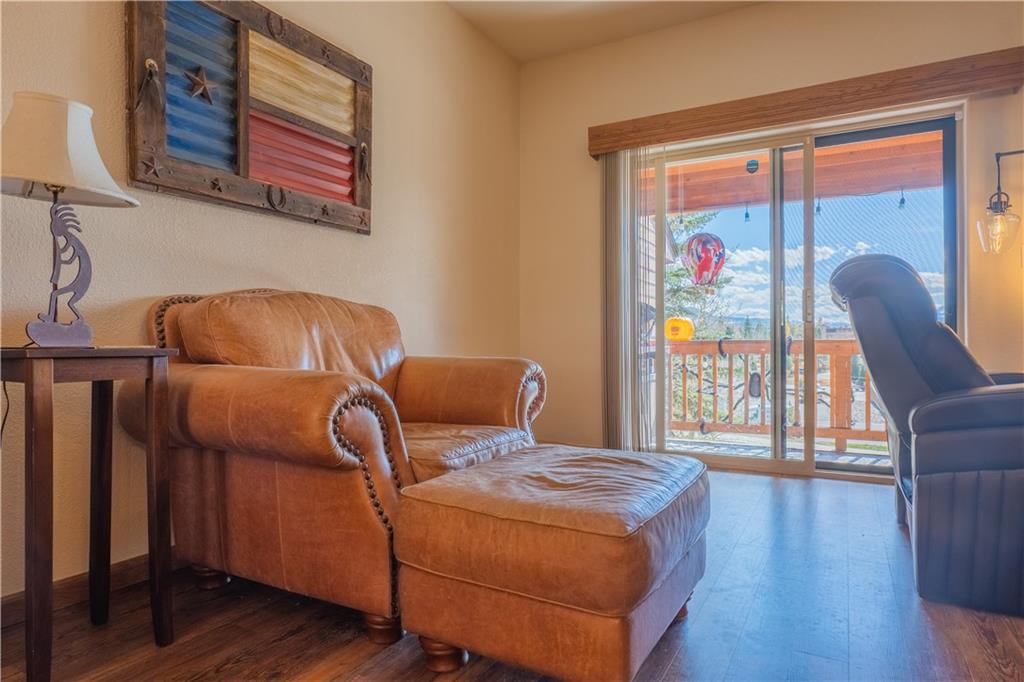 7 Lookout Ridge Drive, Unit 7 Dillon, CO 80435 - Photo 5 of 35 a bedroom with a bed and wooden floor