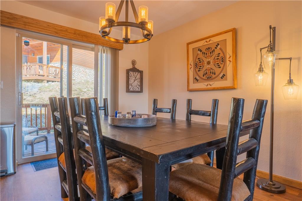 7 Lookout Ridge Drive, Unit 7 Dillon, CO 80435 - Photo 7 of 35 a view of a dining room with furniture window and wooden floor