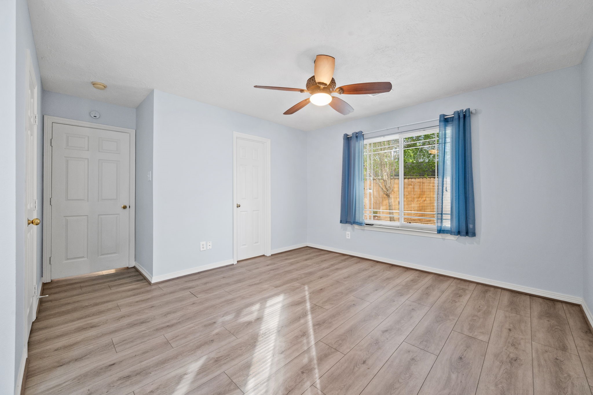 21893 Pinewilde Court Porter, TX 77365 - Photo 13 of 25 wooden floor in an empty room with a window