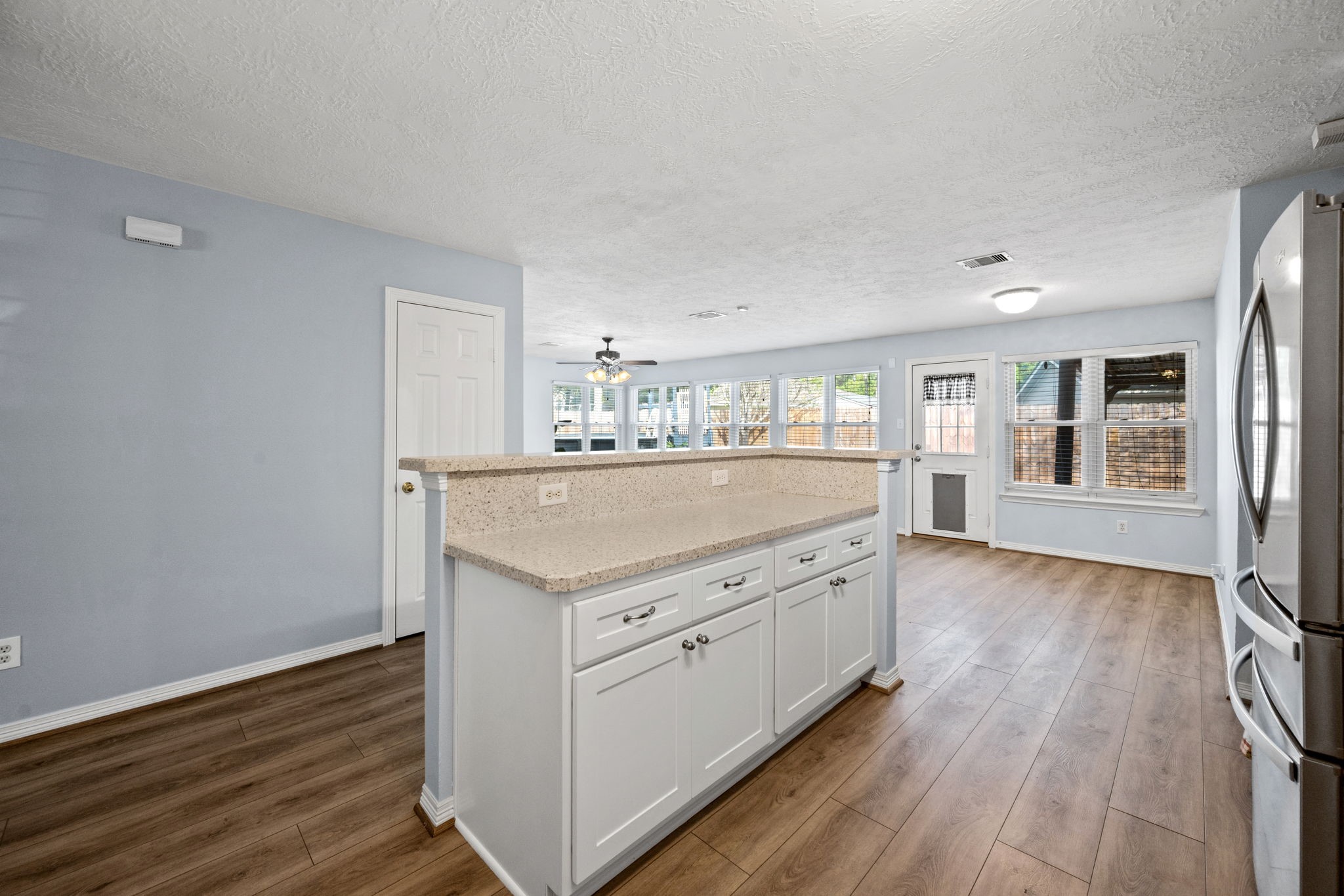 21893 Pinewilde Court Porter, TX 77365 - Photo 16 of 25 a kitchen with a stove and wooden floor