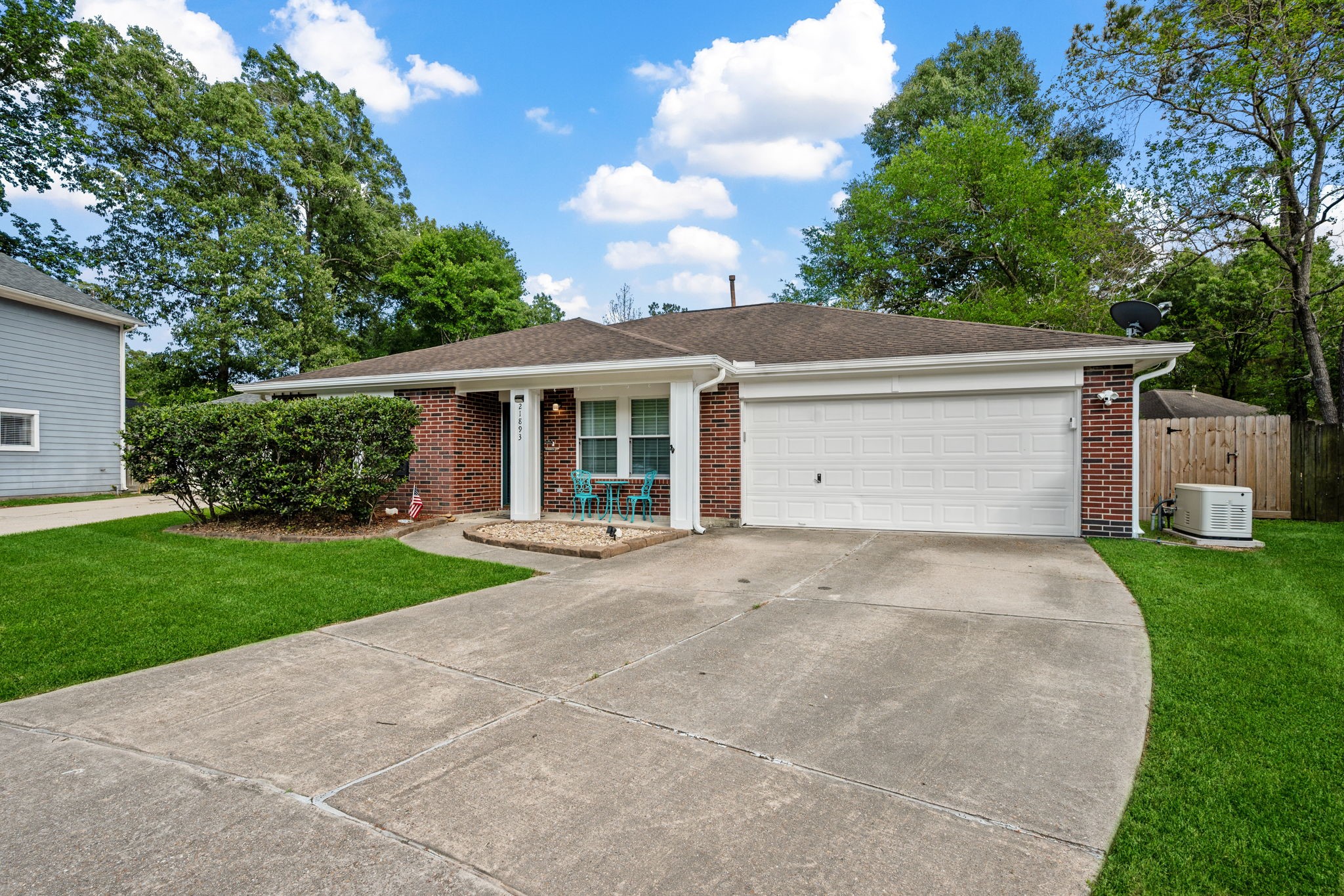 21893 Pinewilde Court Porter, TX 77365 - Photo 2 of 25 a front view of a house with garden