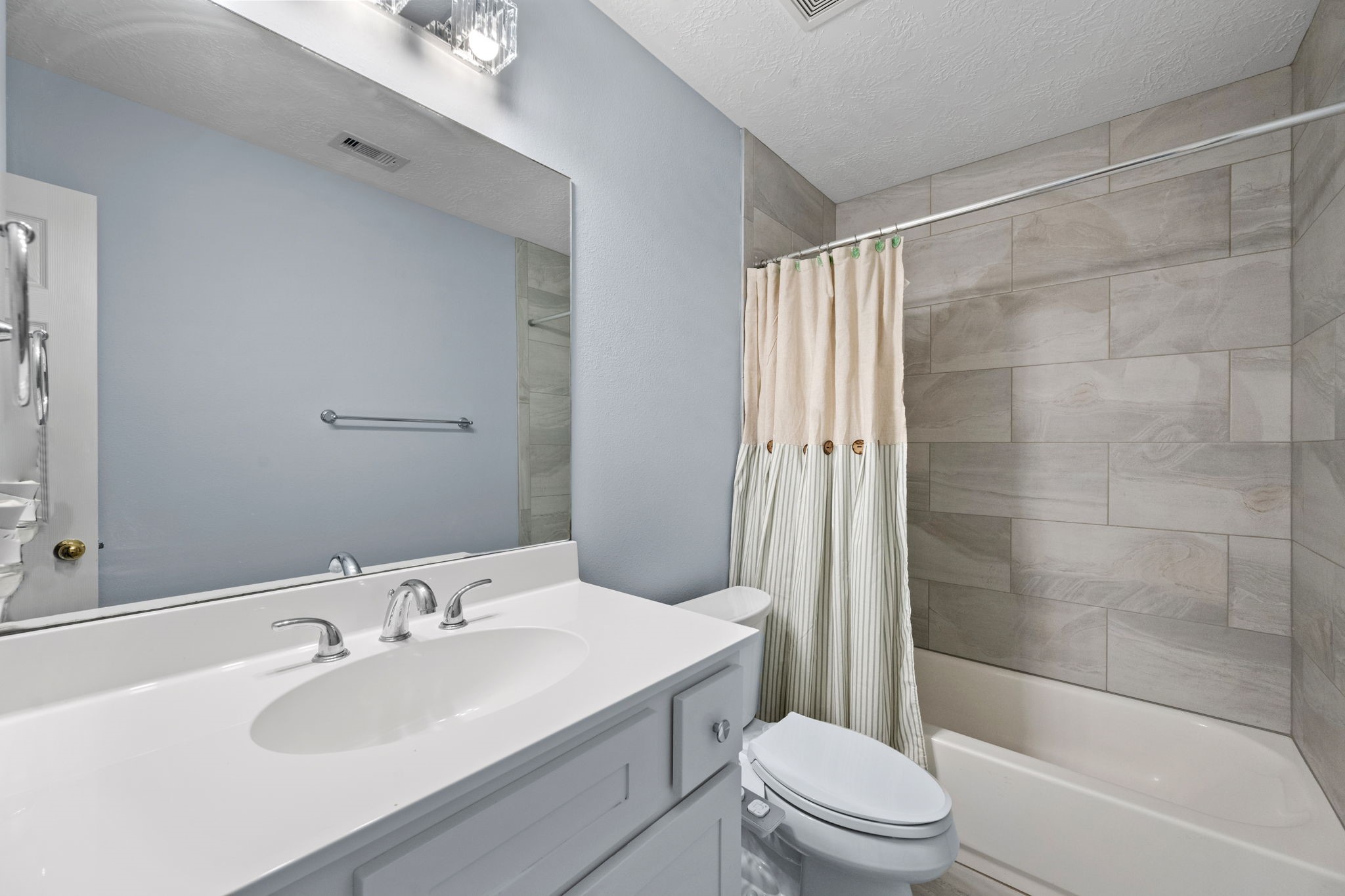 21893 Pinewilde Court Porter, TX 77365 - Photo 25 of 25 a bathroom with a sink a toilet and shower