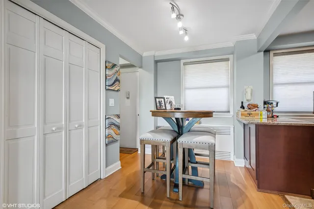 a very nice looking dining room with furniture and a window