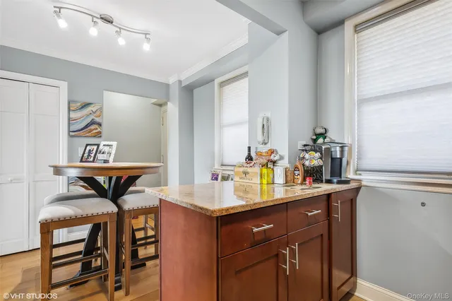 a bathroom with a sink vanity and a mirror