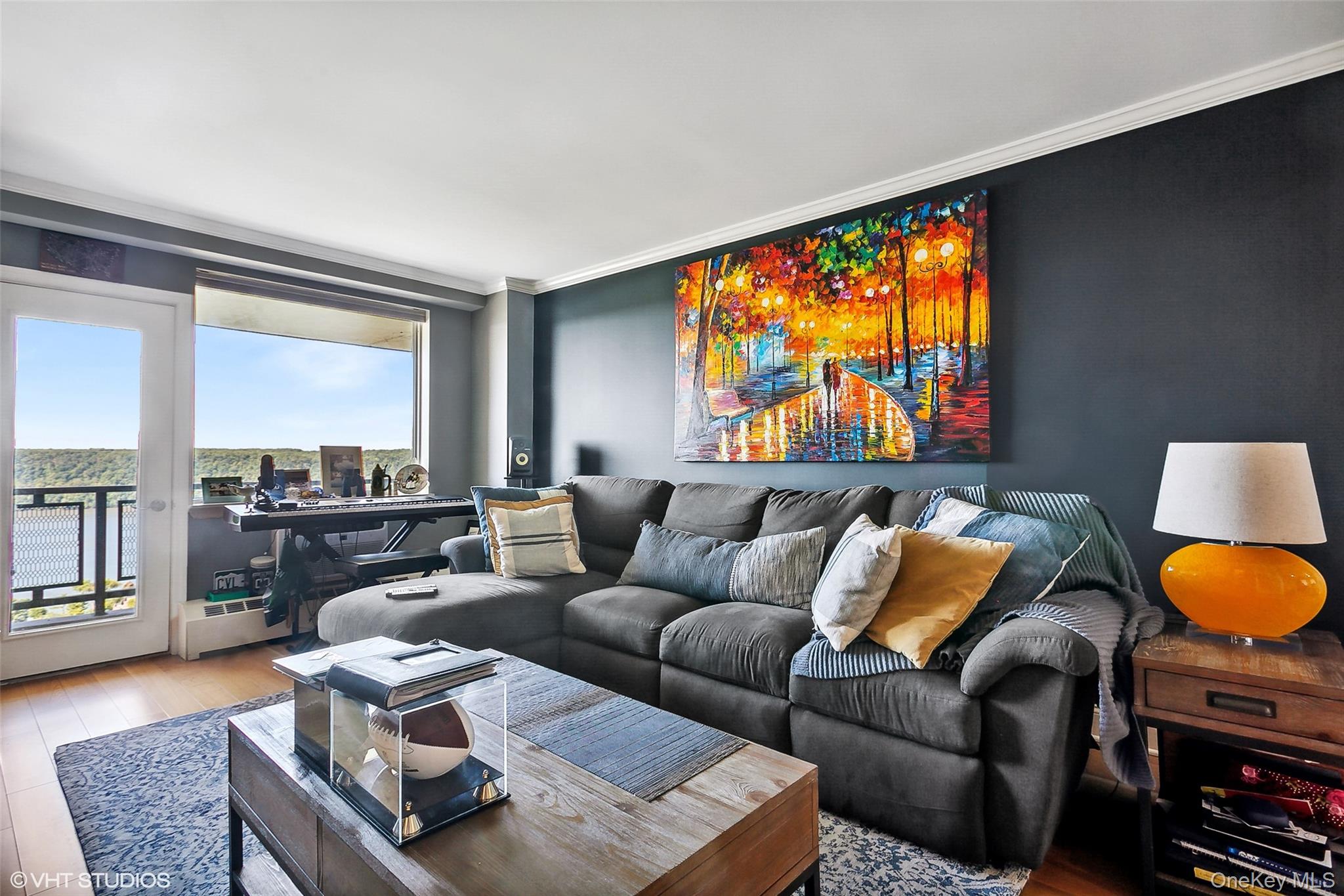 5800 Arlington Avenue, Unit 19L Bronx, NY 10471 - Photo 9 of 19 a living room with furniture and a floor to ceiling window