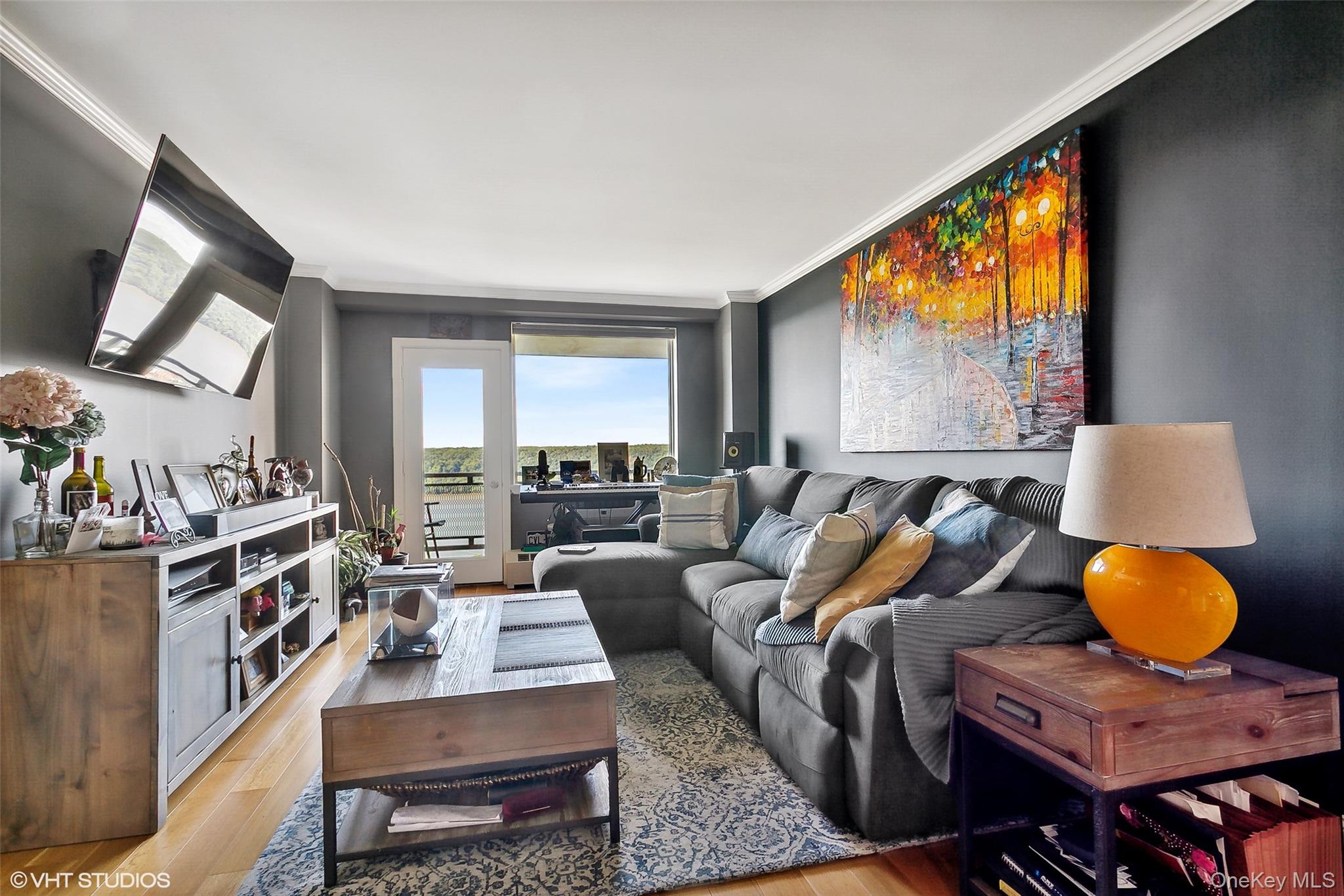 5800 Arlington Avenue, Unit 19L Bronx, NY 10471 - Photo 10 of 19 a living room with furniture and a large window