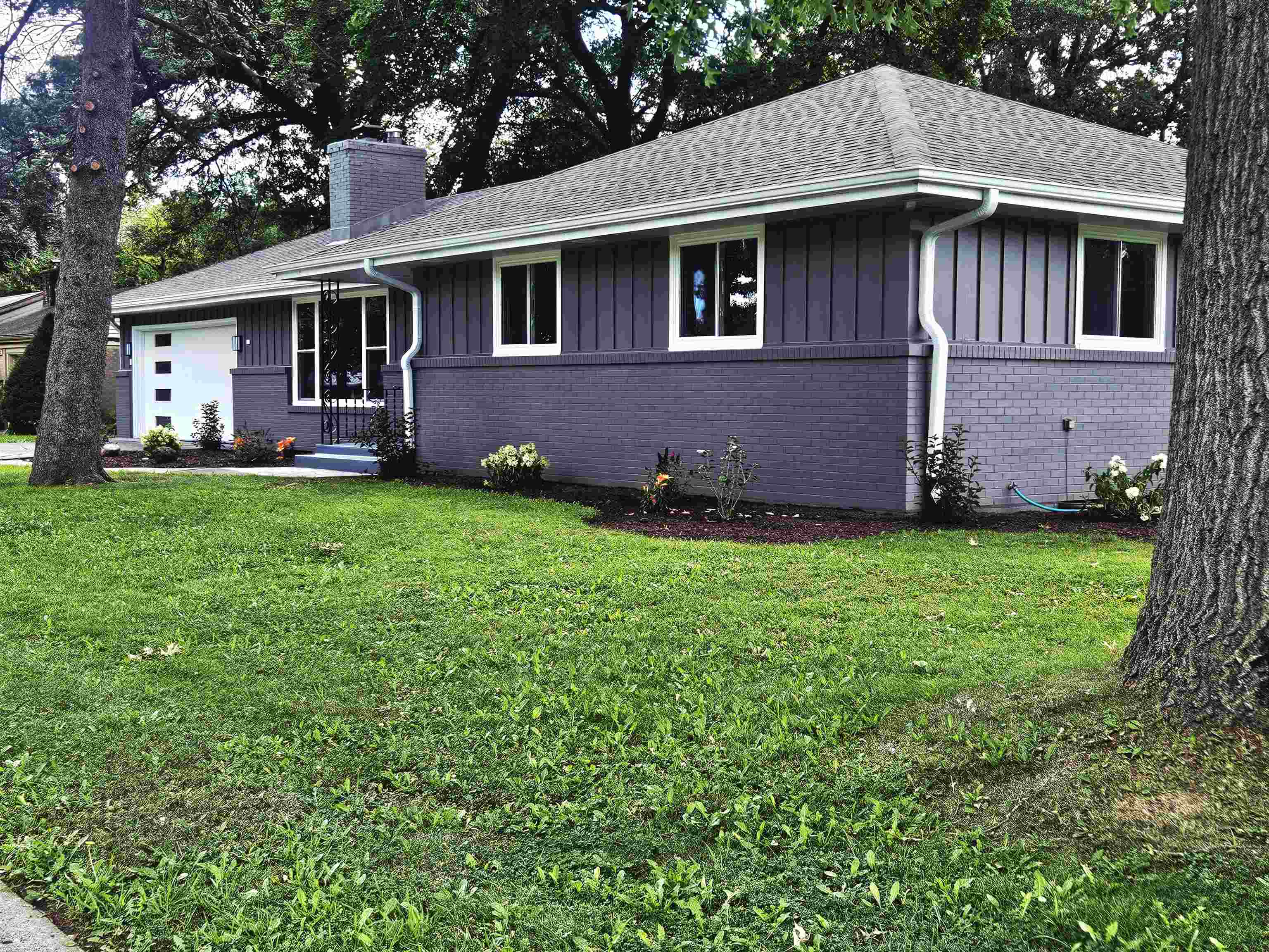 3121 Rural Street Rockford, IL 61107 - Photo 2 of 23 a front view of a house with a yard
