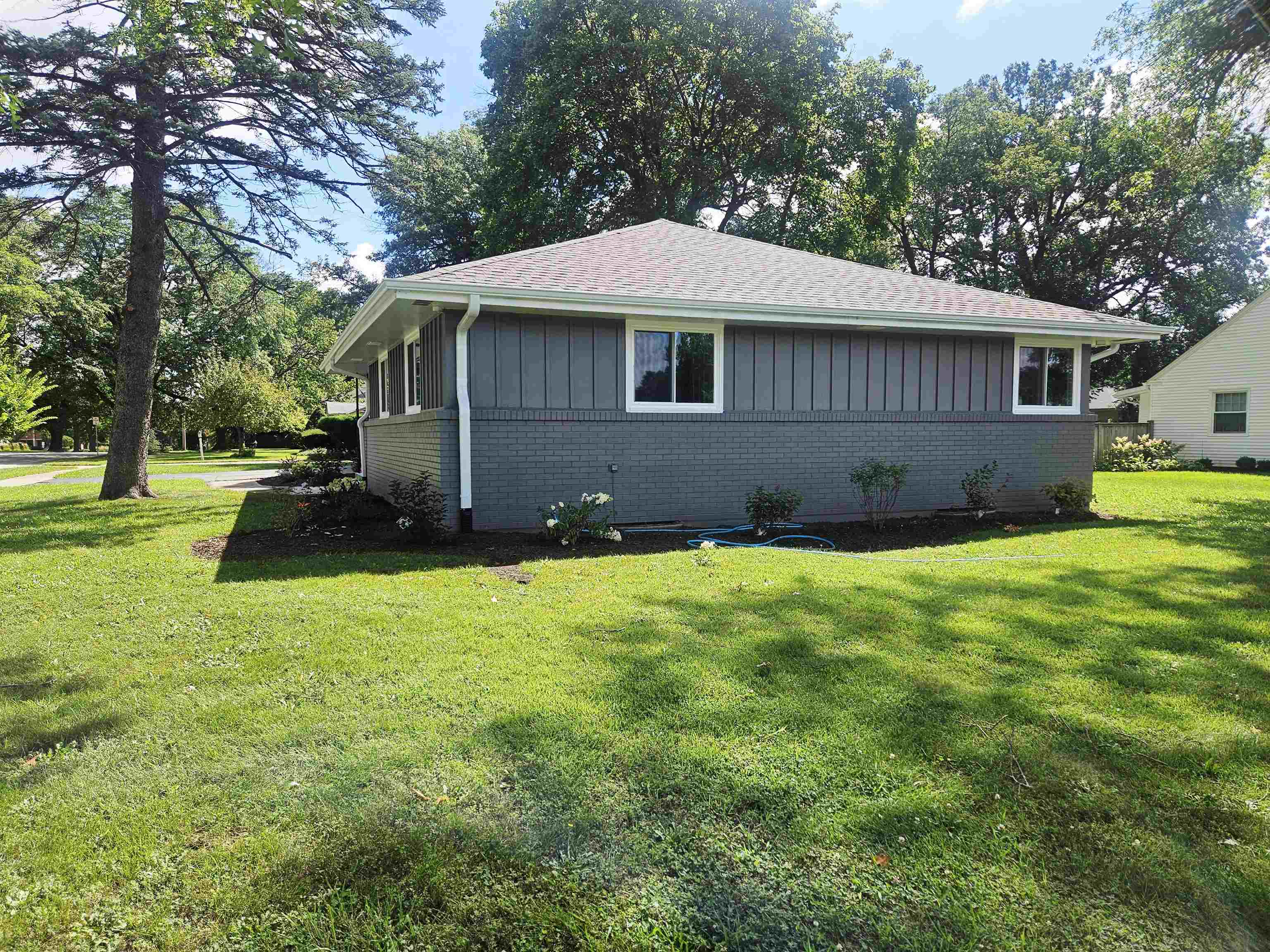 3121 Rural Street Rockford, IL 61107 - Photo 21 of 23 a front view of a house with a garden