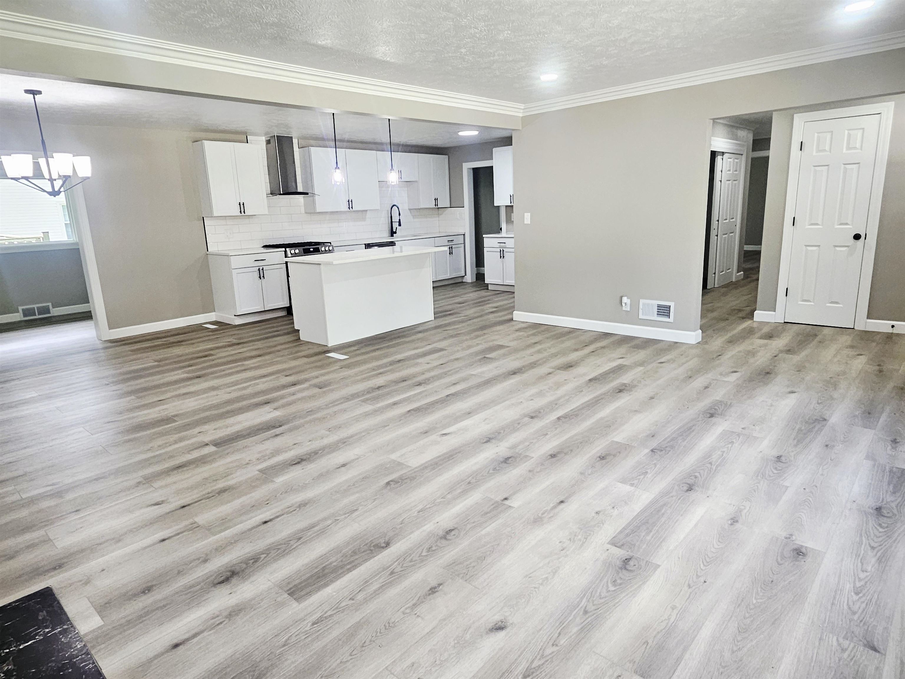 3121 Rural Street Rockford, IL 61107 - Photo 3 of 23 a view of a kitchen with wooden floor