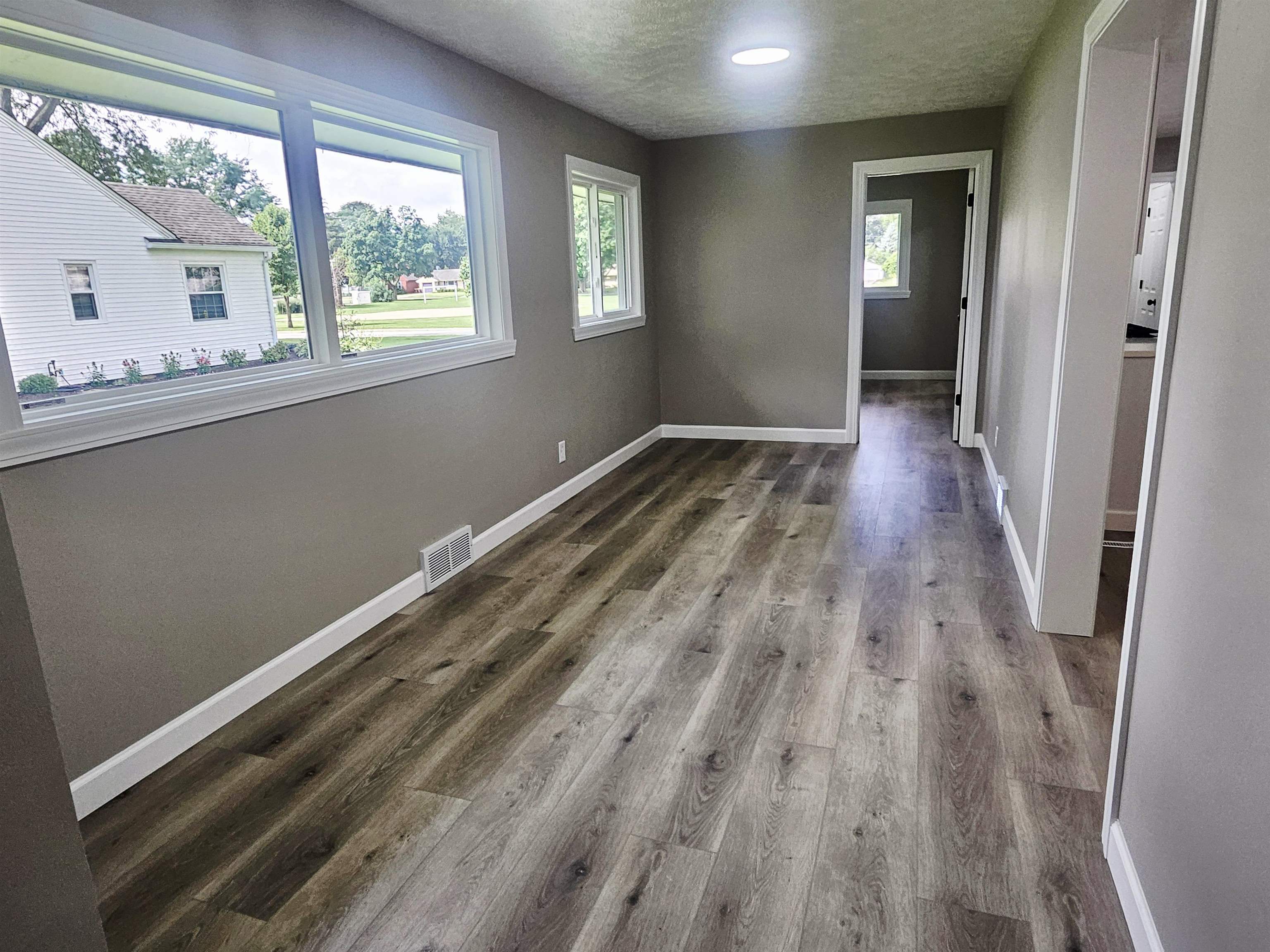 3121 Rural Street Rockford, IL 61107 - Photo 8 of 23 a view of empty room with wooden floor and fan