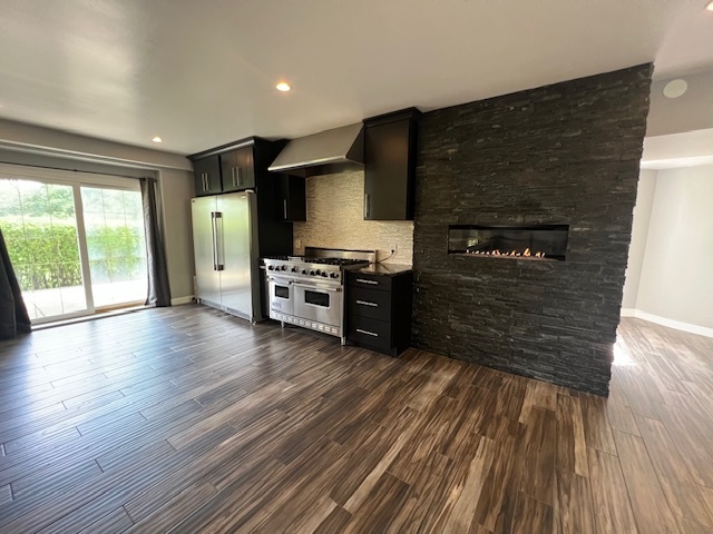 14935 West Old School Road Mettawa, IL 60048 - Photo 15 of 68 a kitchen with stainless steel appliances a stove and wooden floor