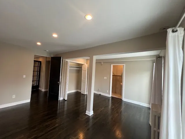 a view of a livingroom with furniture wooden floor and a window