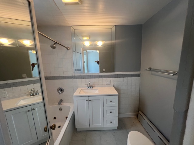 14935 West Old School Road Mettawa, IL 60048 - Photo 34 of 68 a bathroom with a sink a toilet and mirror