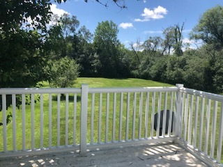 14935 West Old School Road Mettawa, IL 60048 - Photo 53 of 68 a view of a wooden house with a big yard and plants