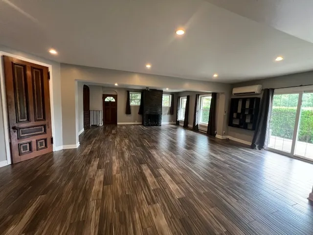 a view of a livingroom with wooden floor