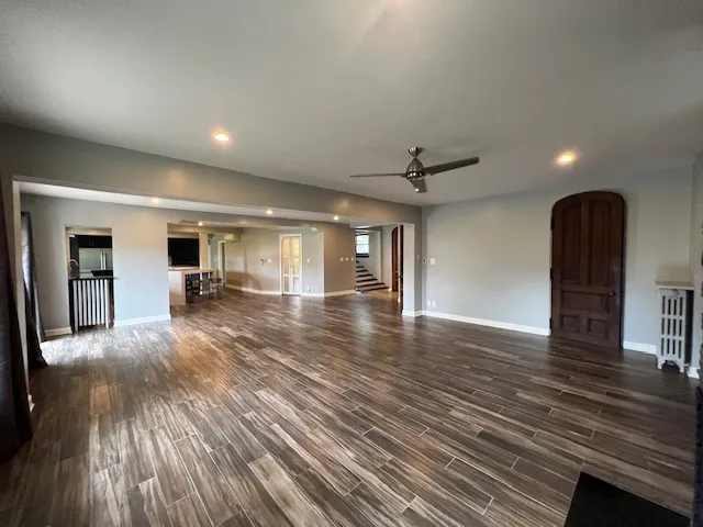 a kitchen with stainless steel appliances a stove a sink a refrigerator and a oven