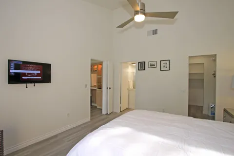a bedroom with a large bed and a window