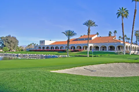 a view of a golf course with a lake view