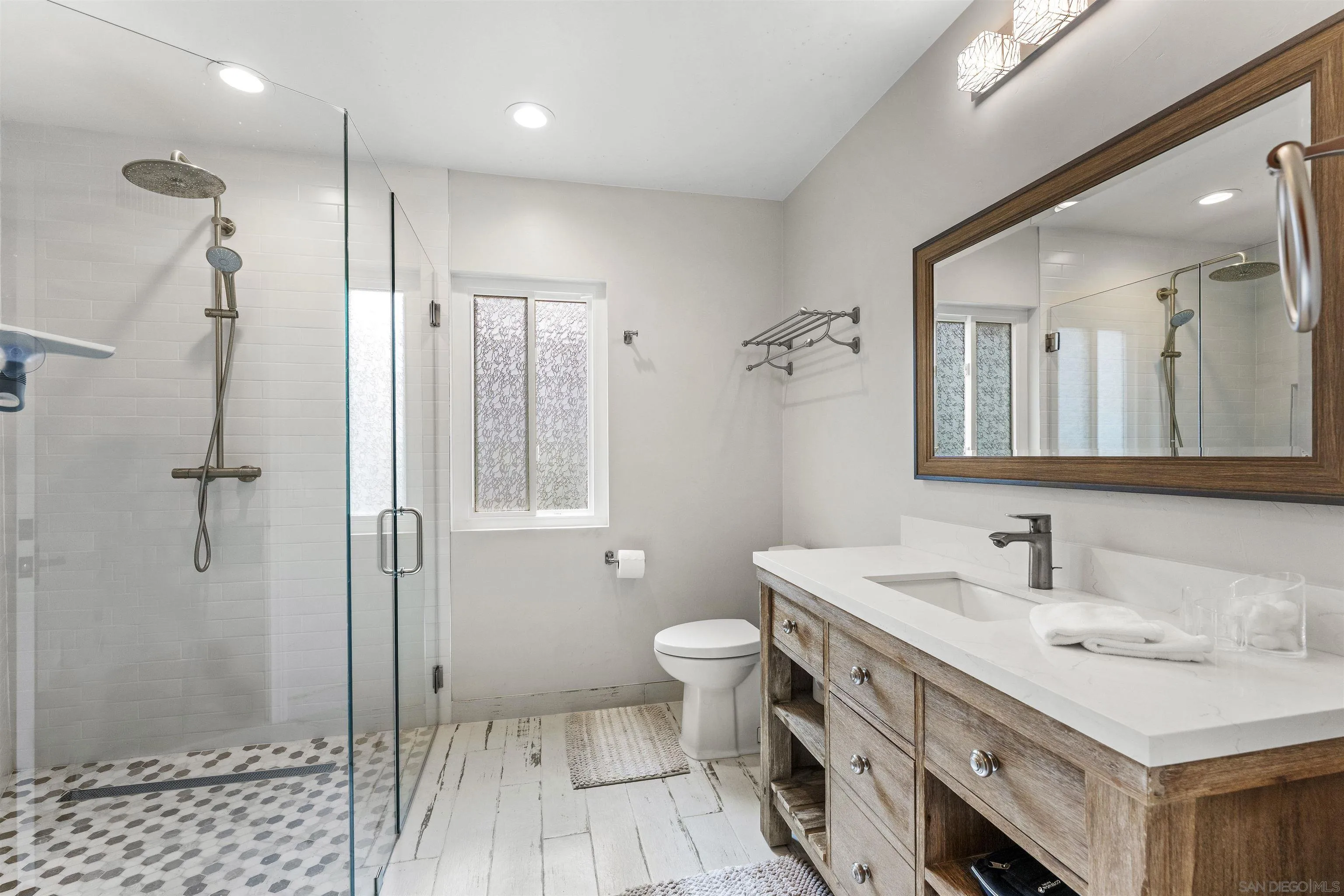 30659 Diaz Road Valley Center, CA 92082 - Photo 28 of 44 a bathroom with a sink a toilet and shower