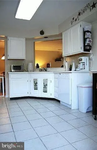 a kitchen with stainless steel appliances cabinets a sink and a counter top space