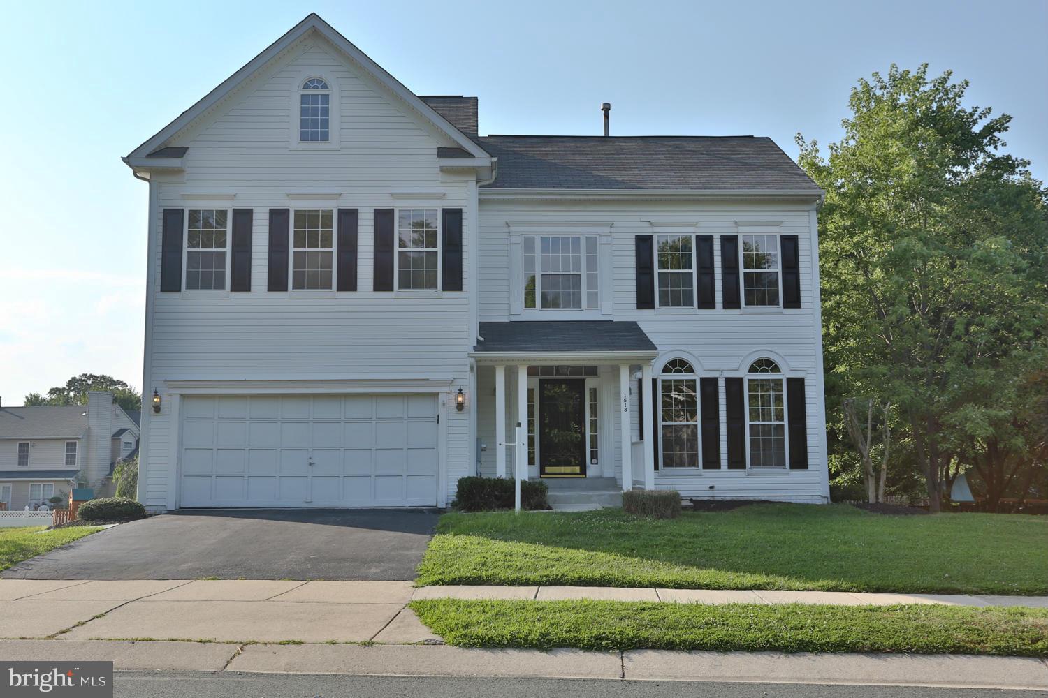 1518 Ringe Drive Severn, MD 21144 - Photo 1 of 30 a front view of a house with a garden and garage