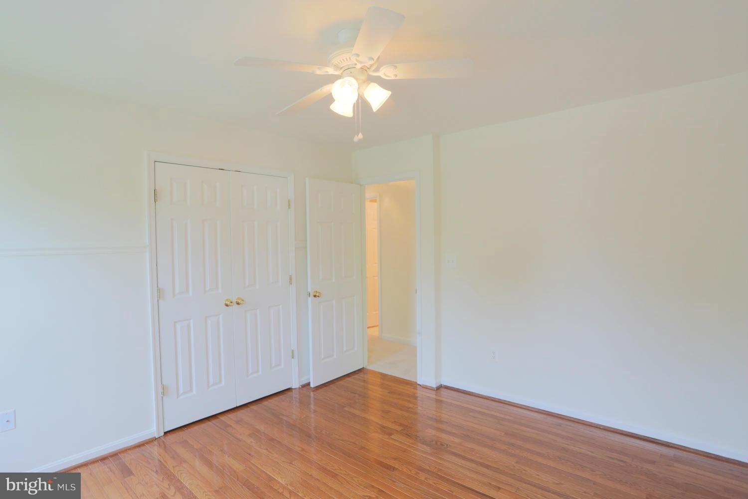 1518 Ringe Drive Severn, MD 21144 - Photo 12 of 30 a view of an empty room with wooden floor
