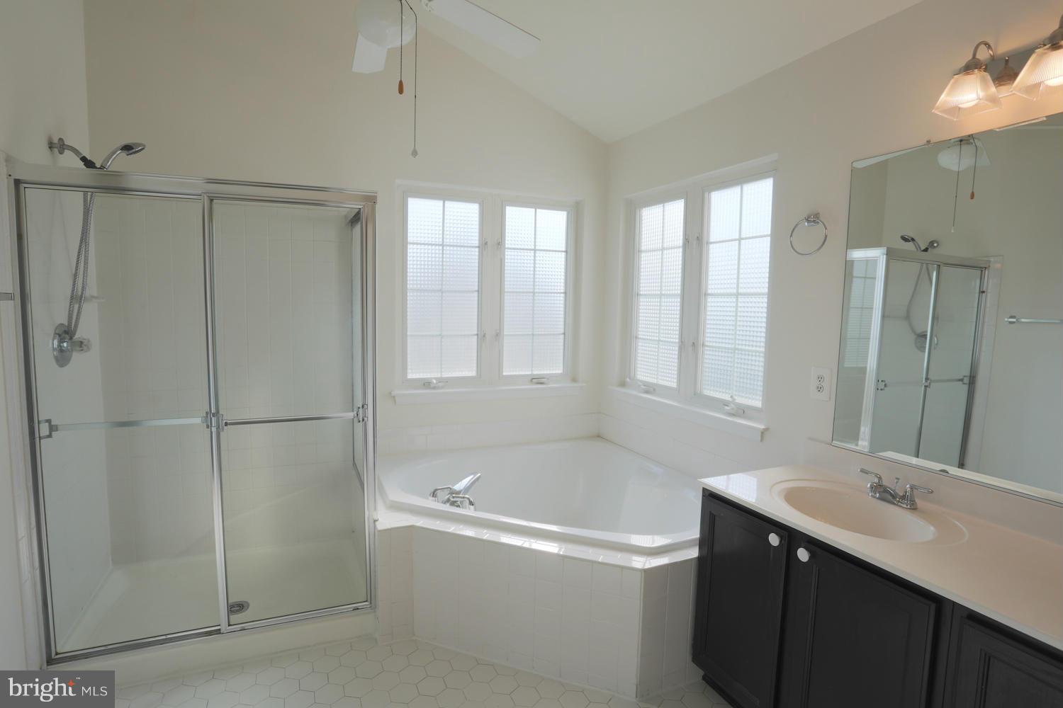 1518 Ringe Drive Severn, MD 21144 - Photo 22 of 30 a bathroom with a bathtub shower sink vanity and a toilet