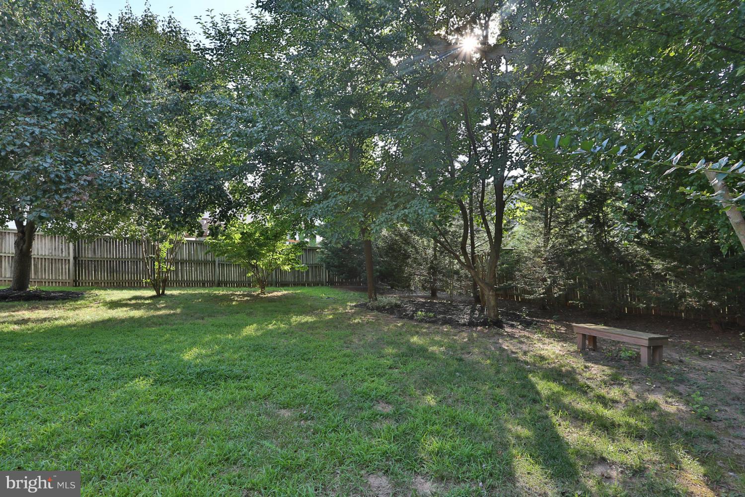 1518 Ringe Drive Severn, MD 21144 - Photo 27 of 30 a view of a backyard with large trees