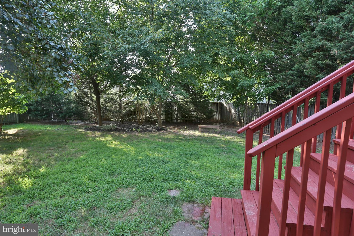 1518 Ringe Drive Severn, MD 21144 - Photo 28 of 30 a view of backyard with deck and trees