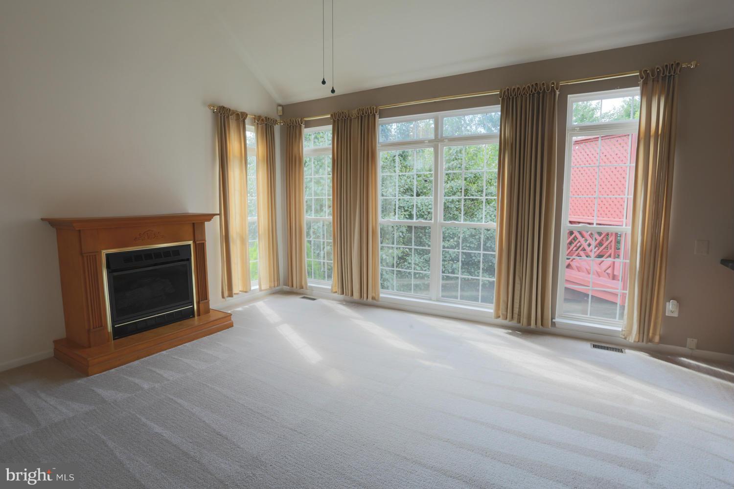 1518 Ringe Drive Severn, MD 21144 - Photo 4 of 30 a view of an empty room with a fireplace and a window