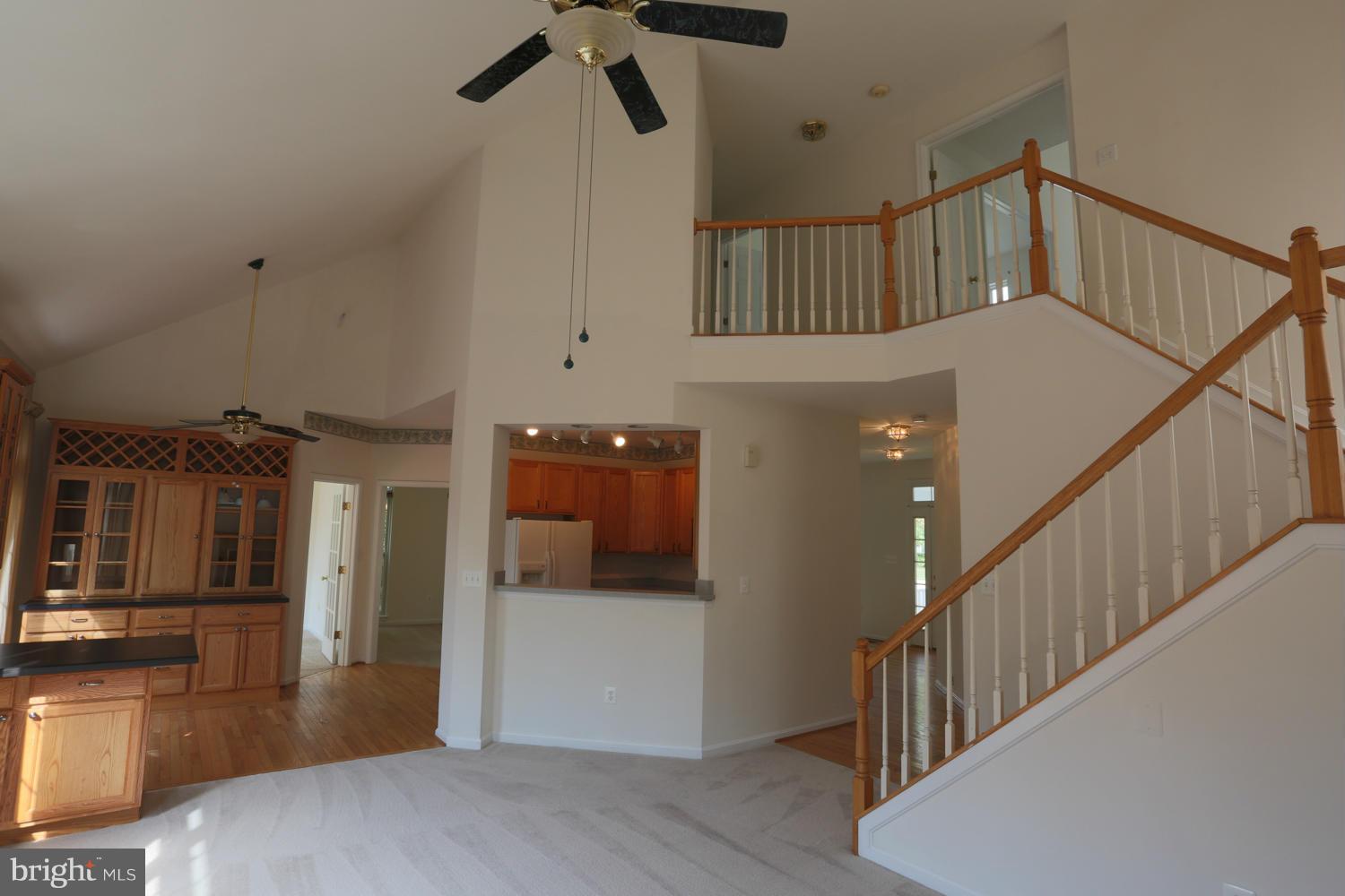 1518 Ringe Drive Severn, MD 21144 - Photo 6 of 30 a view of staircase and kitchen with wooden floor
