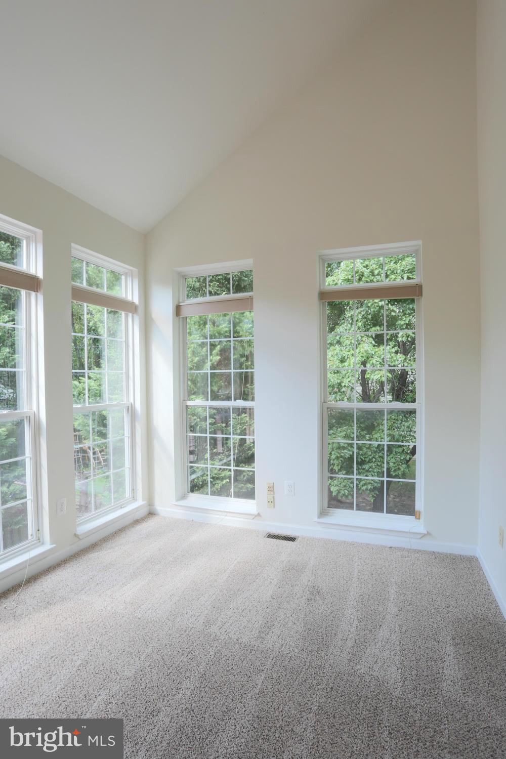 1518 Ringe Drive Severn, MD 21144 - Photo 9 of 30 a view of a big room with windows and chandelier fan