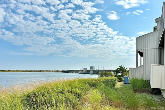 a view of a water pond with green space