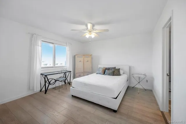 a bathroom with a toilet a sink a mirror and bathtub