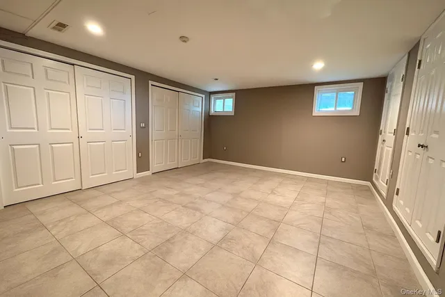 a view of swimming pool with outdoor seating and yard in the back
