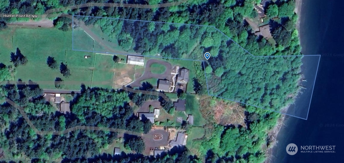 9636 Hunter Point Road Northwest Olympia, WA 98502 - Photo 7 of 9 an aerial view of a house with a yard