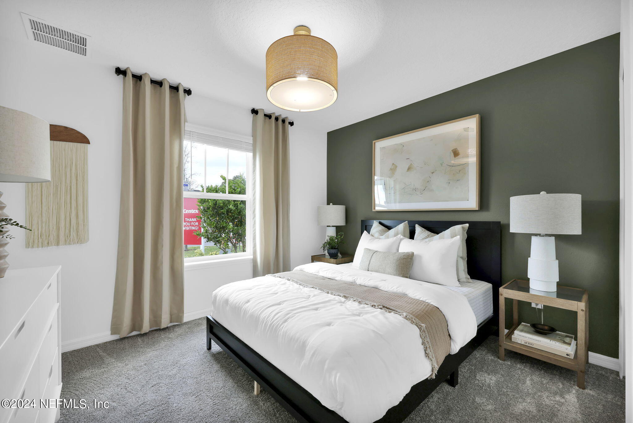 5460 Integrity Way Jacksonville, FL 32244 - Photo 12 of 31 a bedroom with a bed and a lamp