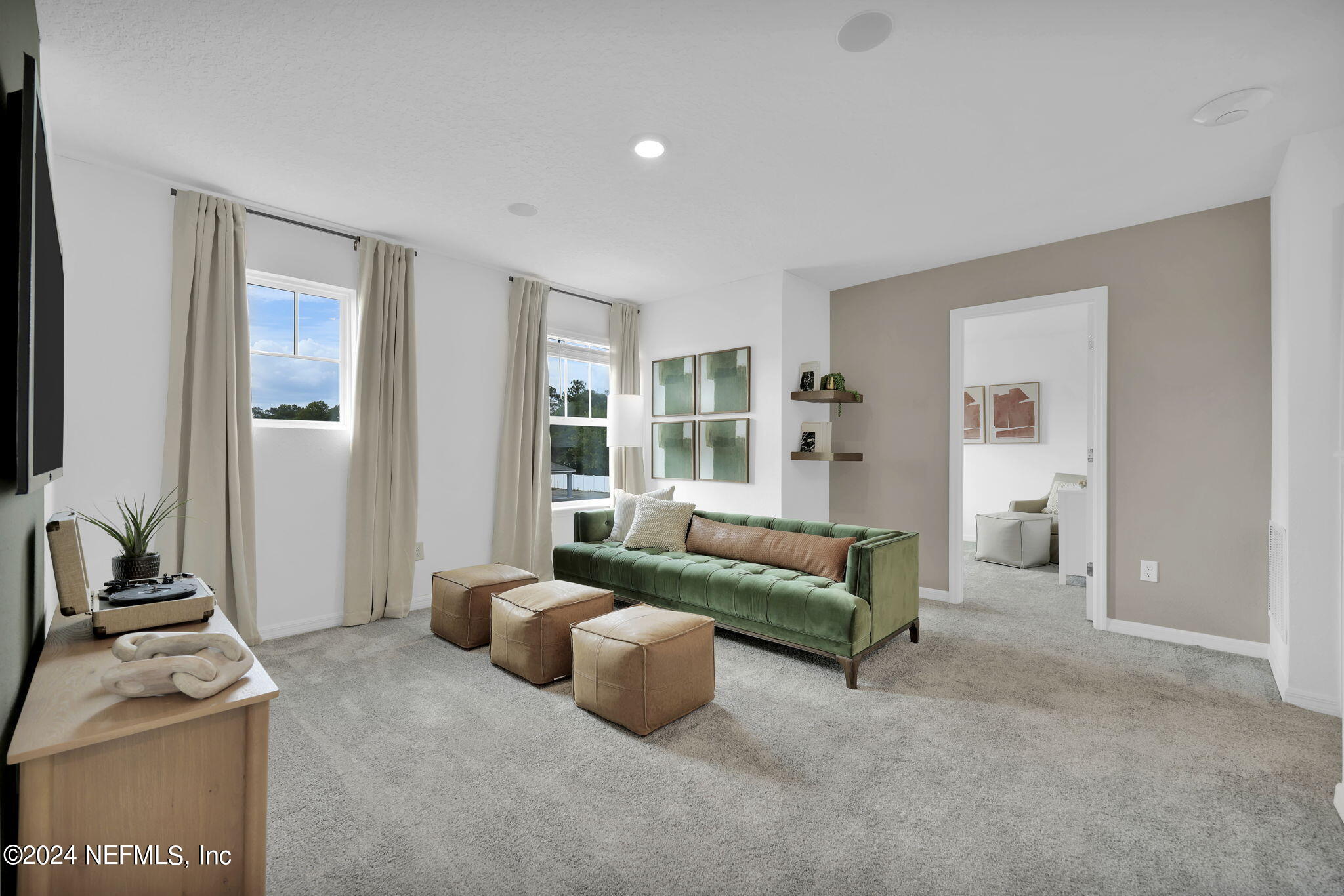 5460 Integrity Way Jacksonville, FL 32244 - Photo 15 of 31 a living room with furniture and a flat screen tv